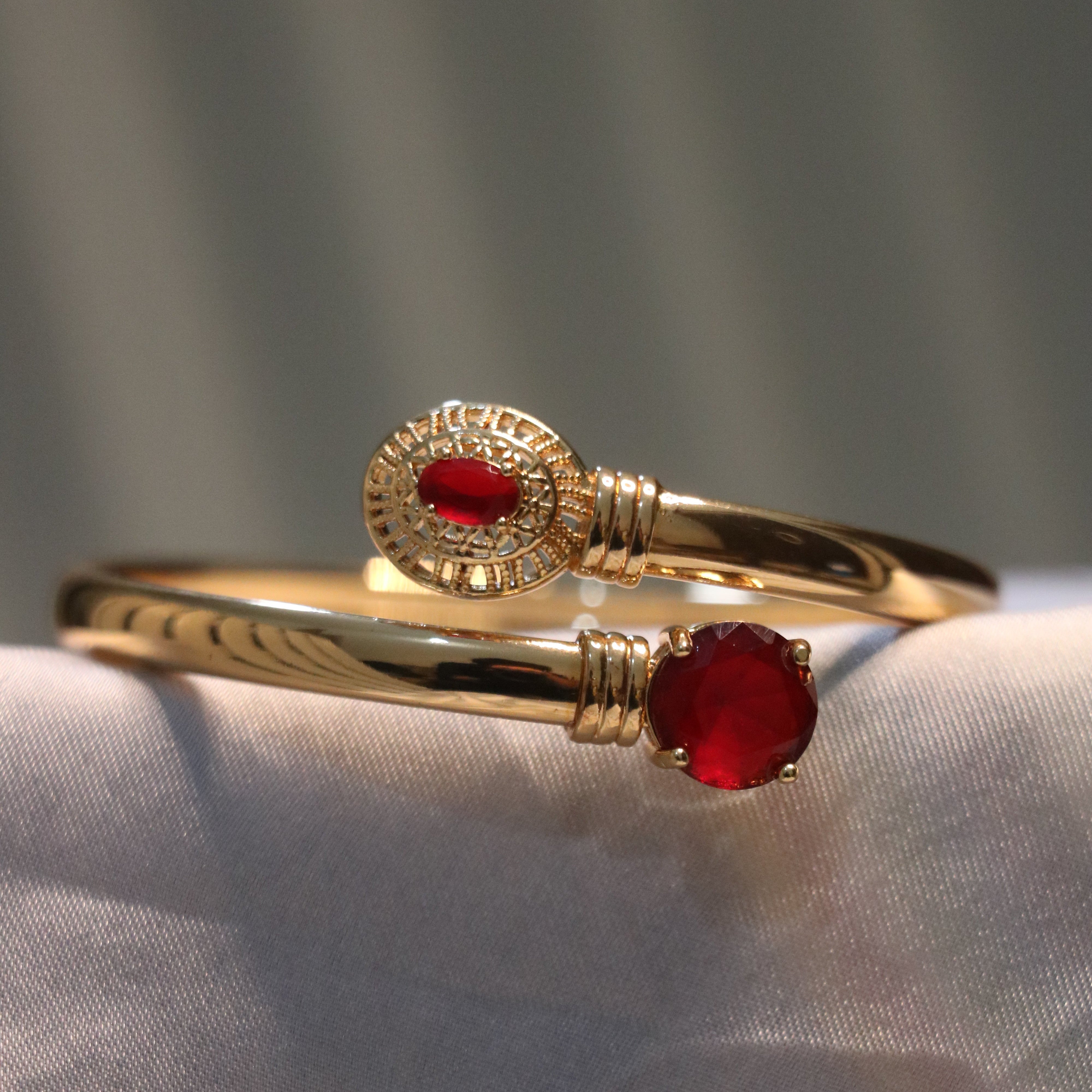 Golden Ruby Charm Bracelet – A Statement of Elegance and Grace